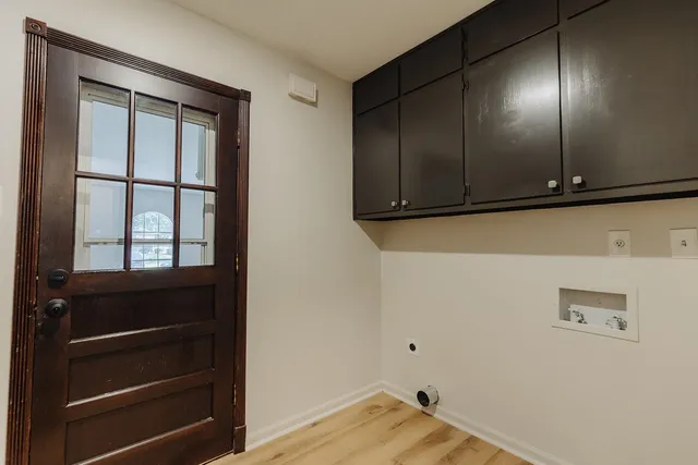 a view of an empty room and wooden floor