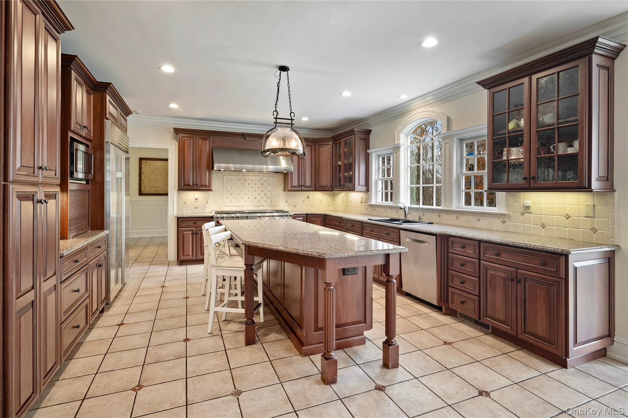 11 Lost Nations Road Pound Ridge, NY 10576 - Photo 14 of 42 a kitchen with stainless steel appliances granite countertop a stove a sink and a refrigerator