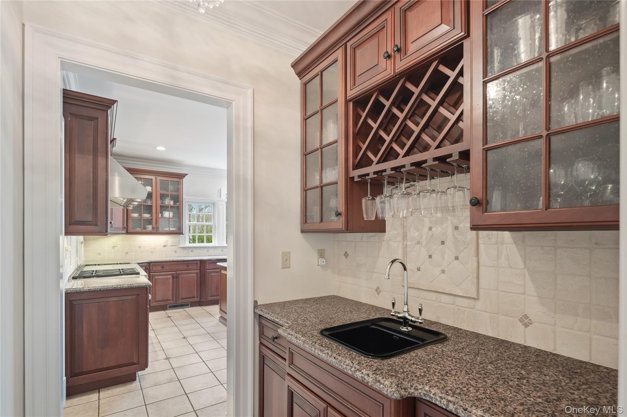 11 Lost Nations Road Pound Ridge, NY 10576 - Photo 18 of 42 a kitchen with a sink a stove and cabinets