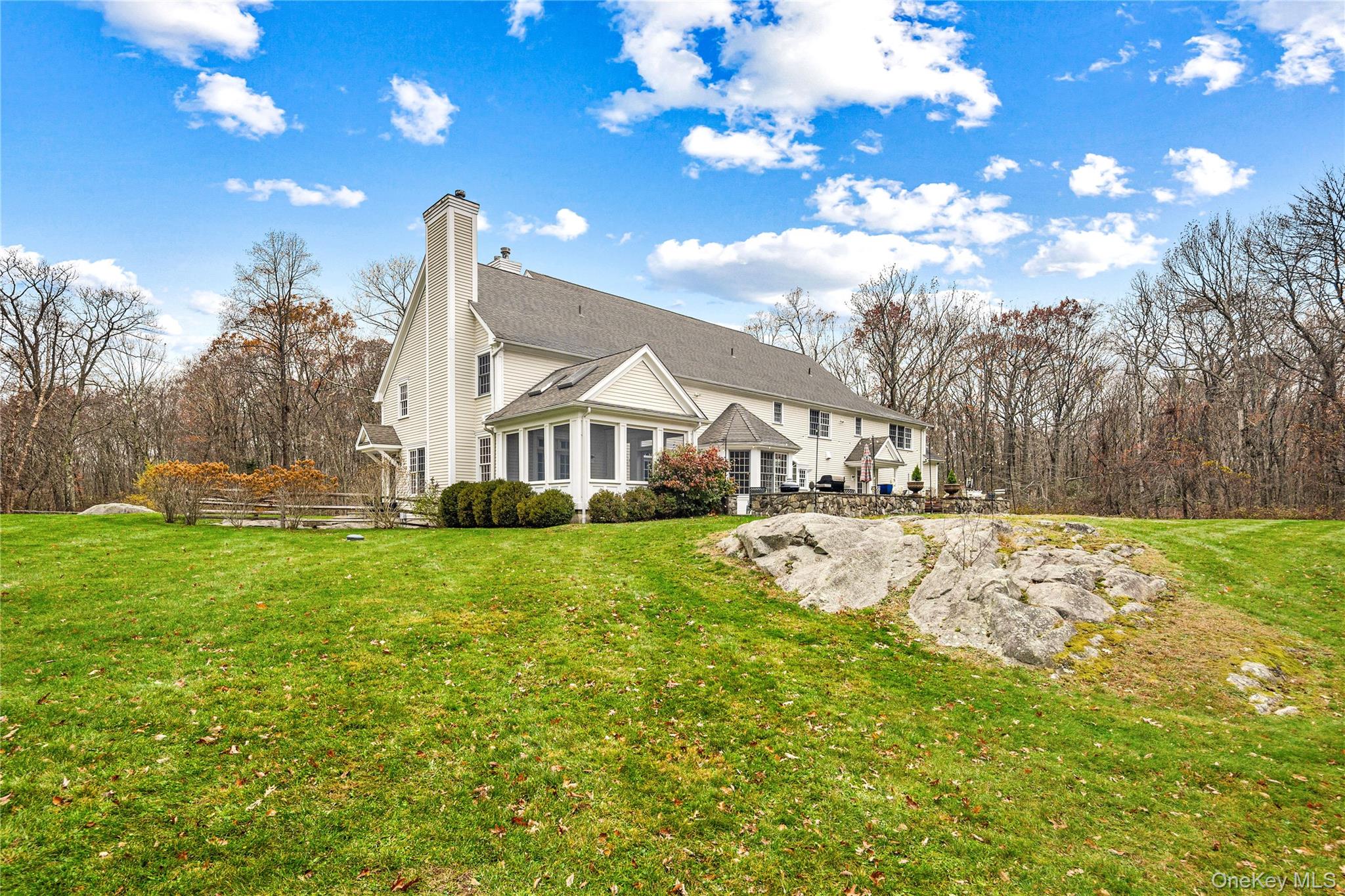 11 Lost Nations Road Pound Ridge, NY 10576 - Photo 22 of 42 a view of a house with a yard