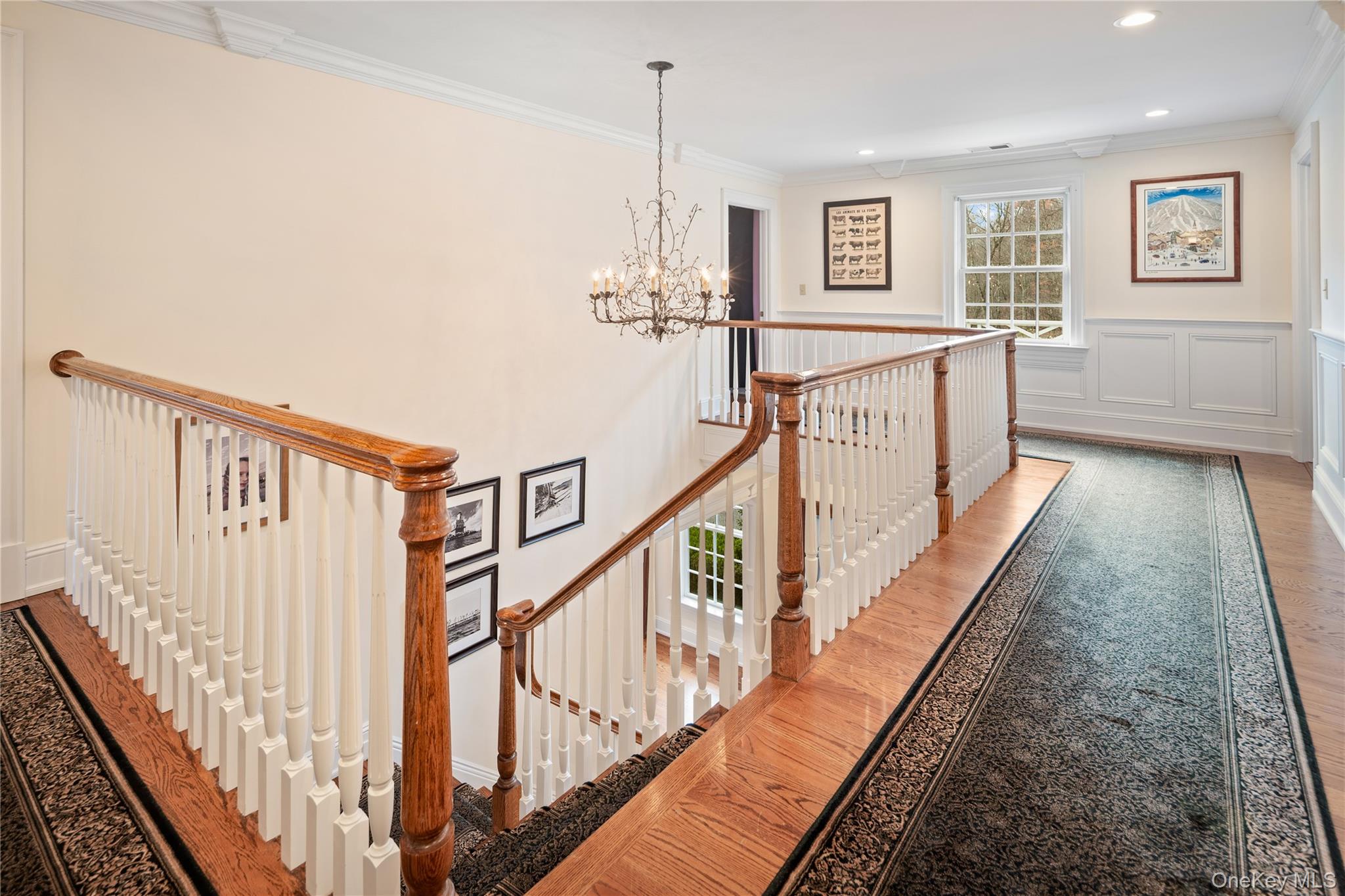 11 Lost Nations Road Pound Ridge, NY 10576 - Photo 33 of 42 a view of a hallway with wooden floor and staircase