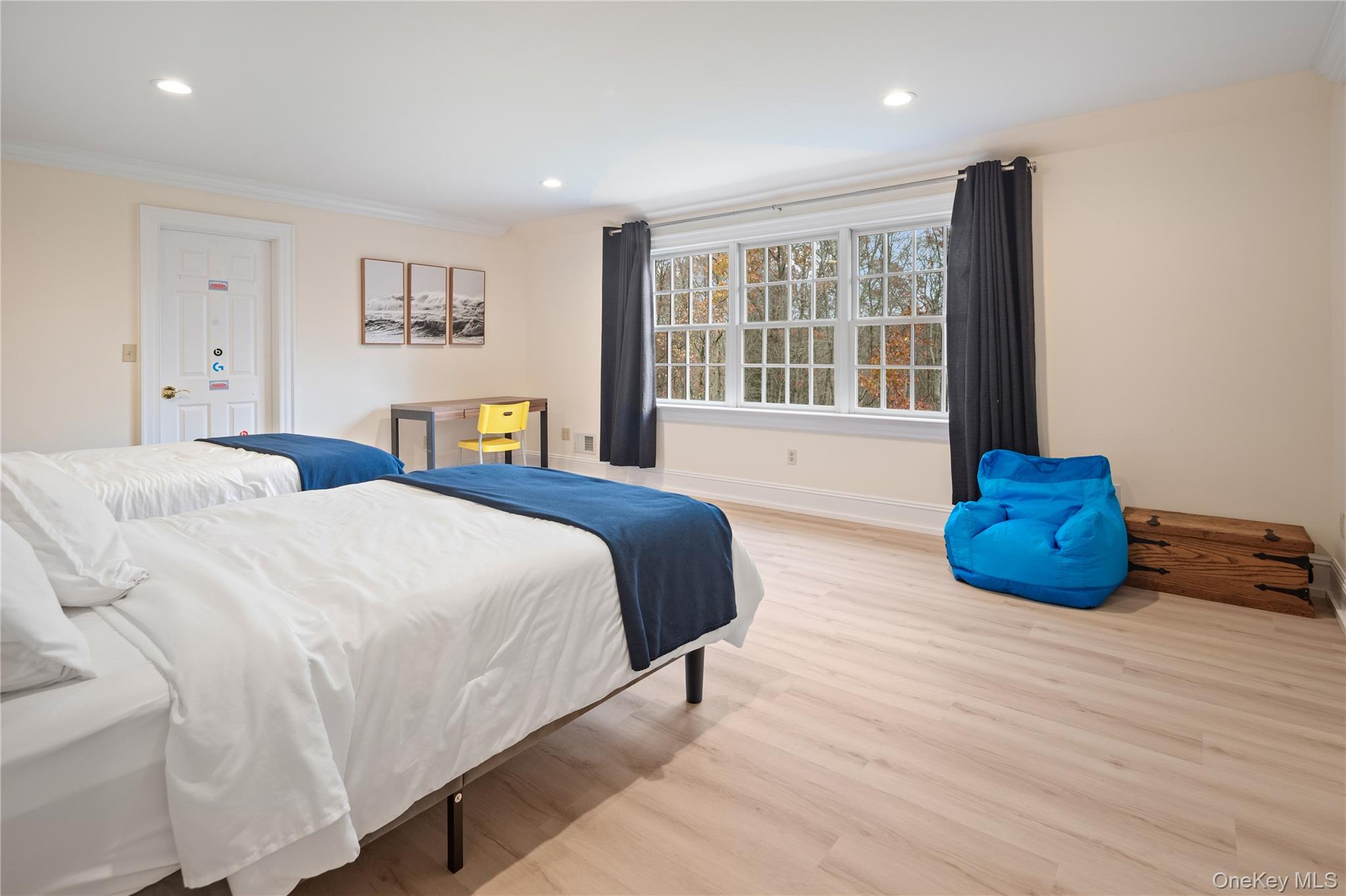 11 Lost Nations Road Pound Ridge, NY 10576 - Photo 36 of 42 a bedroom with two beds and a large window