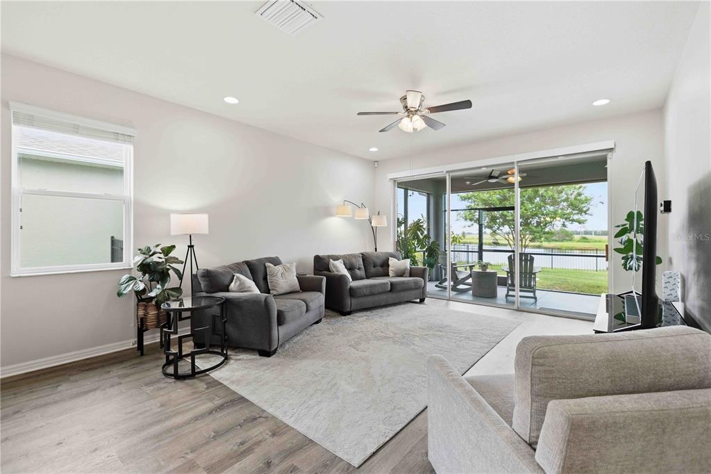 10920 79th Street East Parrish, FL 34219 - Photo 17 of 73 a living room with furniture and a large window