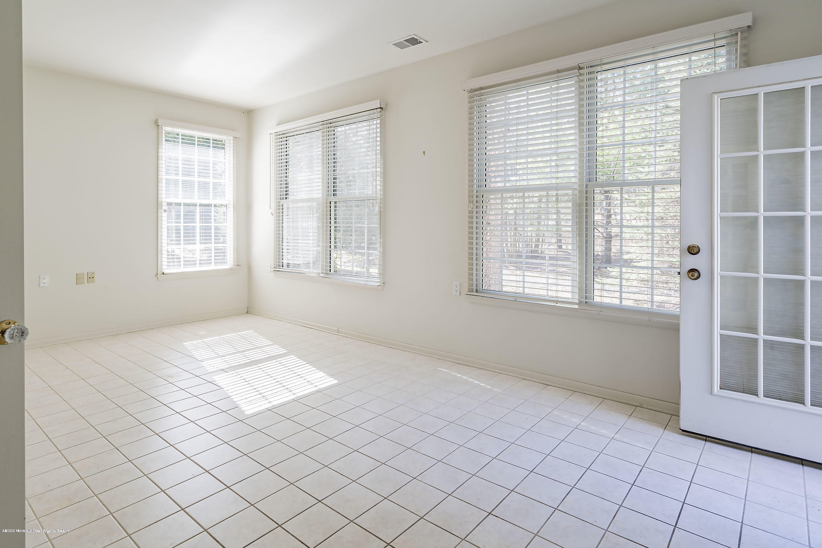 7 Elsworth Place Holmdel, NJ 07733 - Photo 12 of 23 a view of an empty room with windows