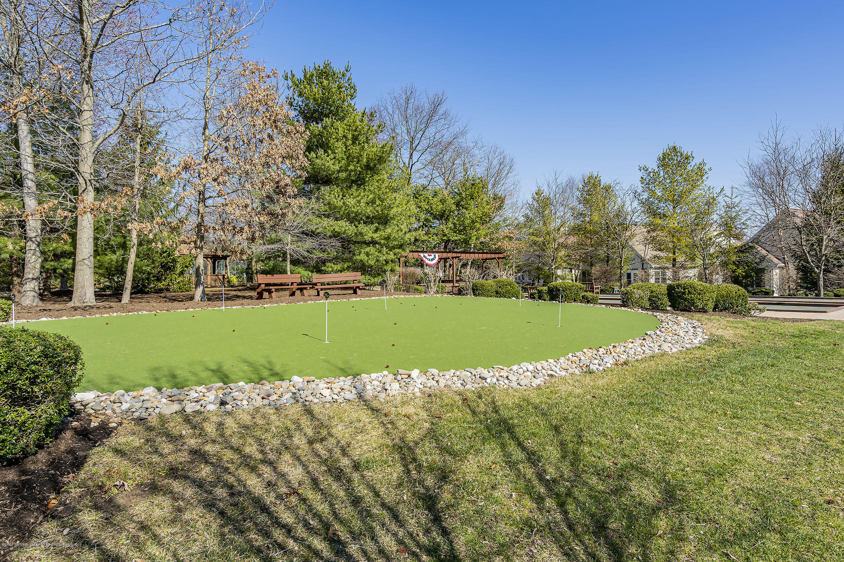 7 Elsworth Place Holmdel, NJ 07733 - Photo 22 of 23 a view of a golf course with a lake
