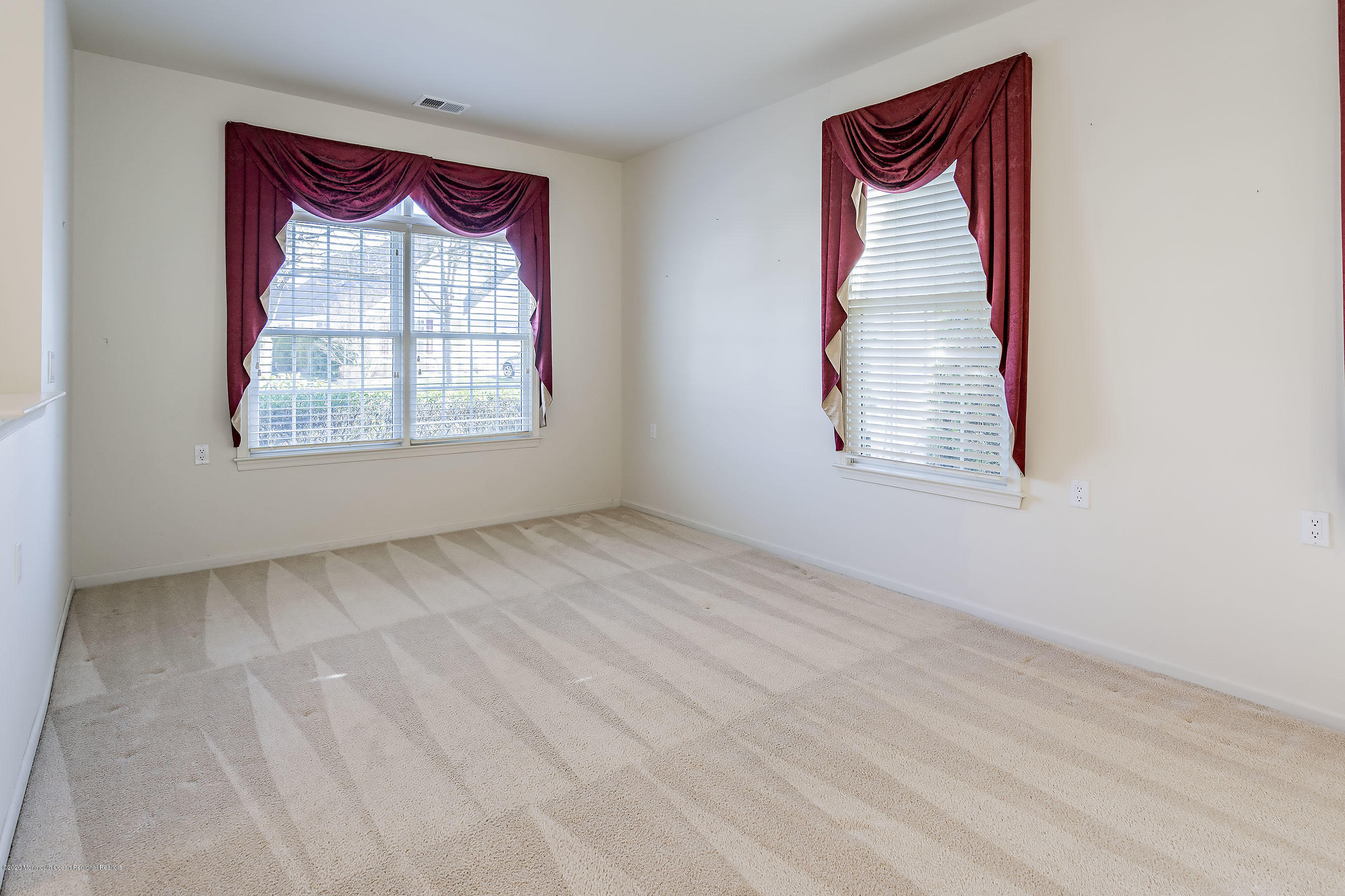 7 Elsworth Place Holmdel, NJ 07733 - Photo 4 of 23 an empty room with windows