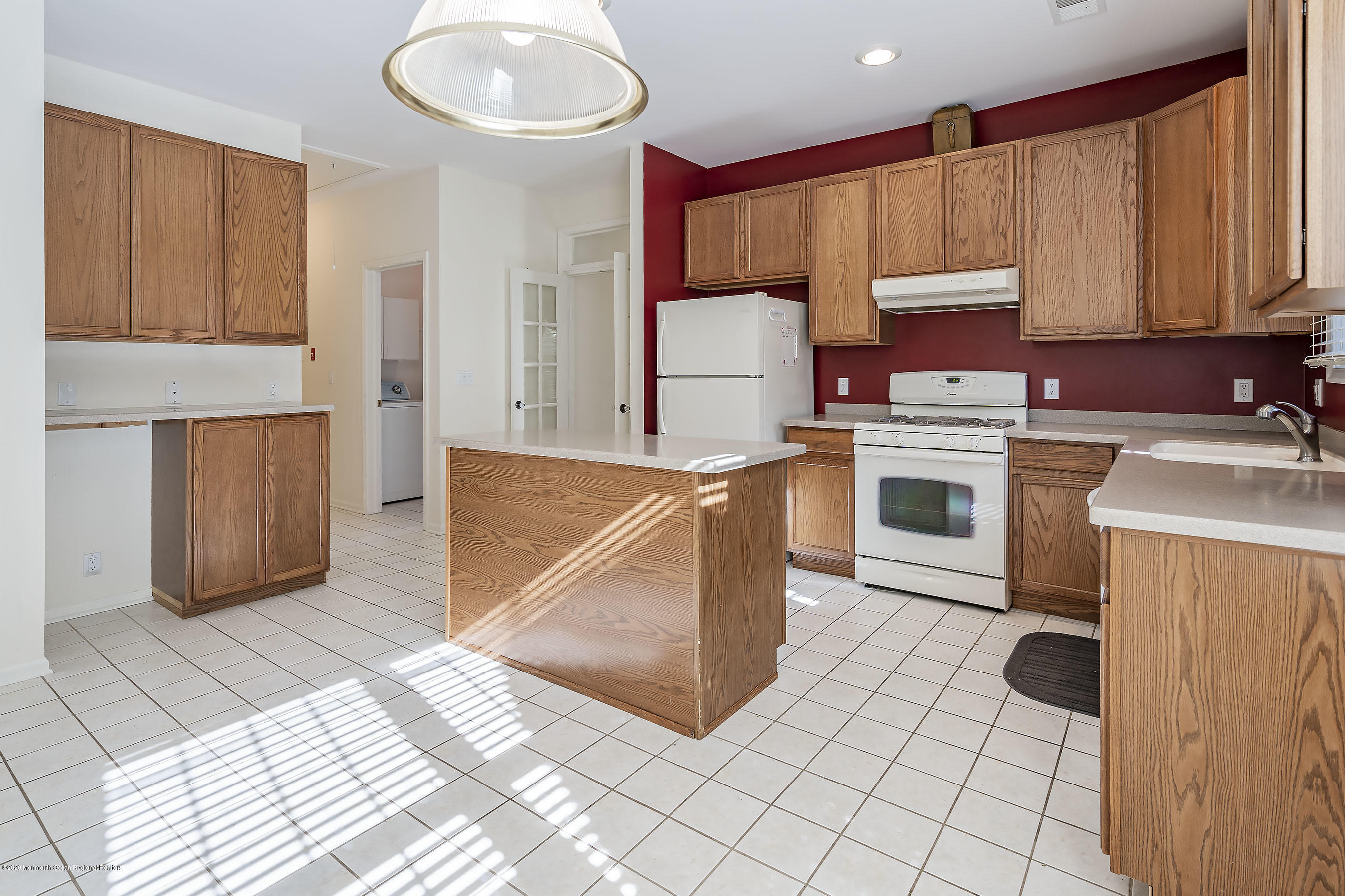 7 Elsworth Place Holmdel, NJ 07733 - Photo 7 of 23 a kitchen with a sink cabinets and appliances