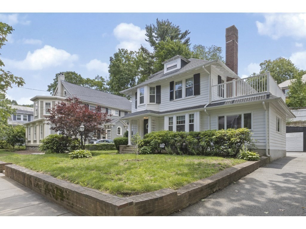 230 Clark Road Brookline, MA 02445 - Photo 1 of 27 a front view of a house with a yard