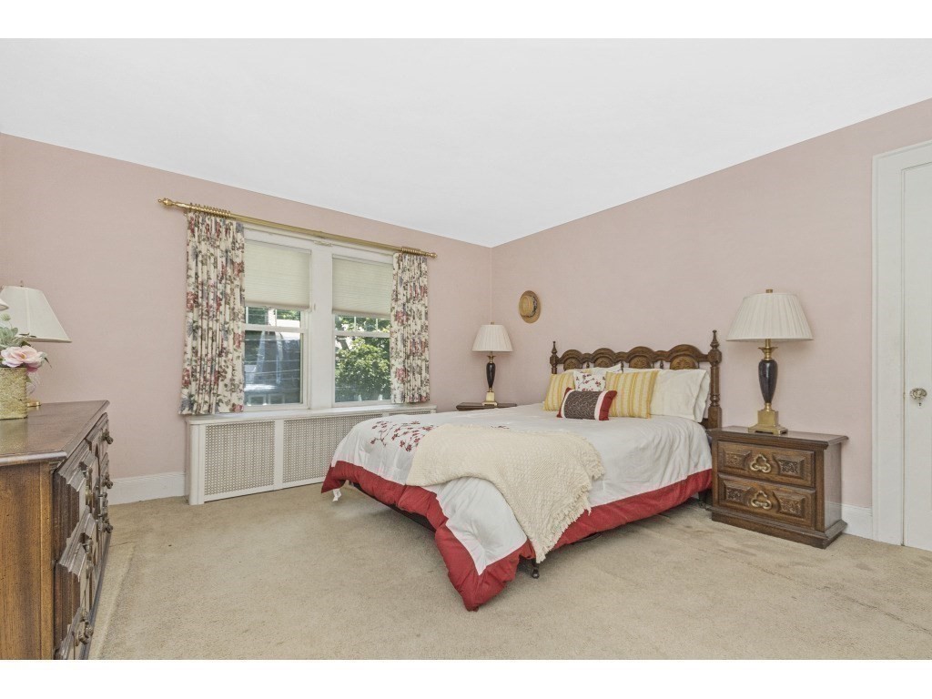 230 Clark Road Brookline, MA 02445 - Photo 11 of 27 a spacious bedroom with a bed and window