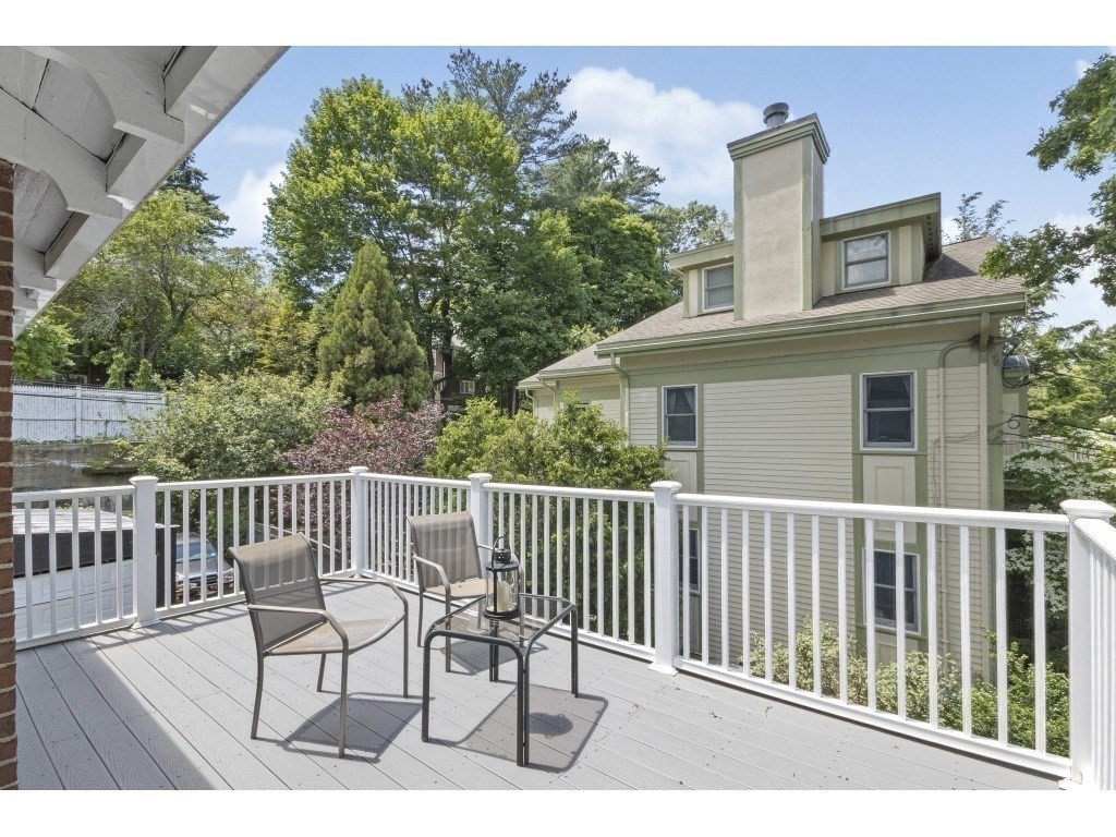 230 Clark Road Brookline, MA 02445 - Photo 18 of 27 a view of a chair and table on the deck