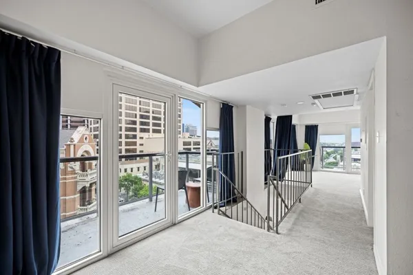 a view of livingroom with furniture and floor to ceiling window