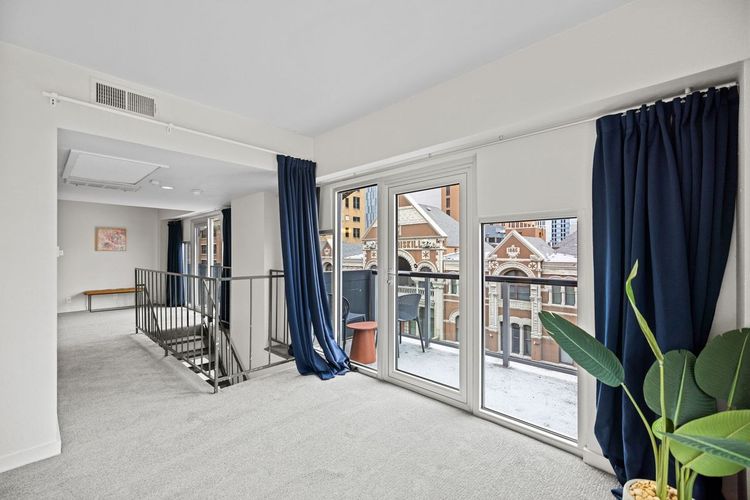119 East 6th Street, Unit 701 Austin, TX 78701 - Photo 9 of 20 a view of a livingroom with a furniture and floor to ceiling window