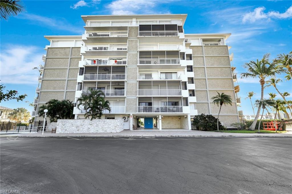 60 West Pelican Street, Unit 401 Naples, FL 34113 - Photo 26 of 31 a view of building with a street