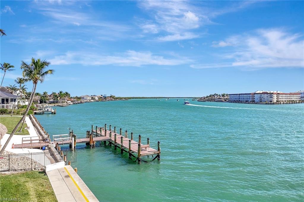 60 West Pelican Street, Unit 401 Naples, FL 34113 - Photo 29 of 31 a view of a lake with a big yard