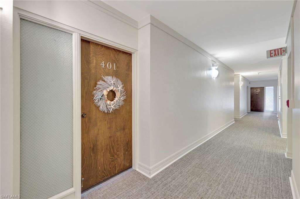60 West Pelican Street, Unit 401 Naples, FL 34113 - Photo 5 of 31 a view of a hallway