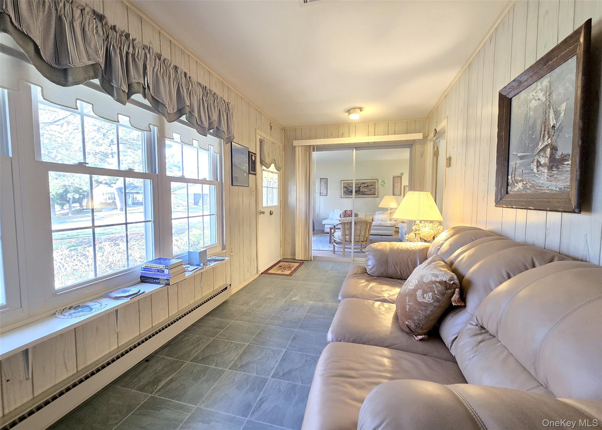 289 Cardiff Court, Unit B Ridge, NY 11961 - Photo 11 of 20 a living room with furniture and large windows