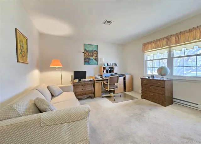 a bathroom with a granite countertop sink mirror and toilet