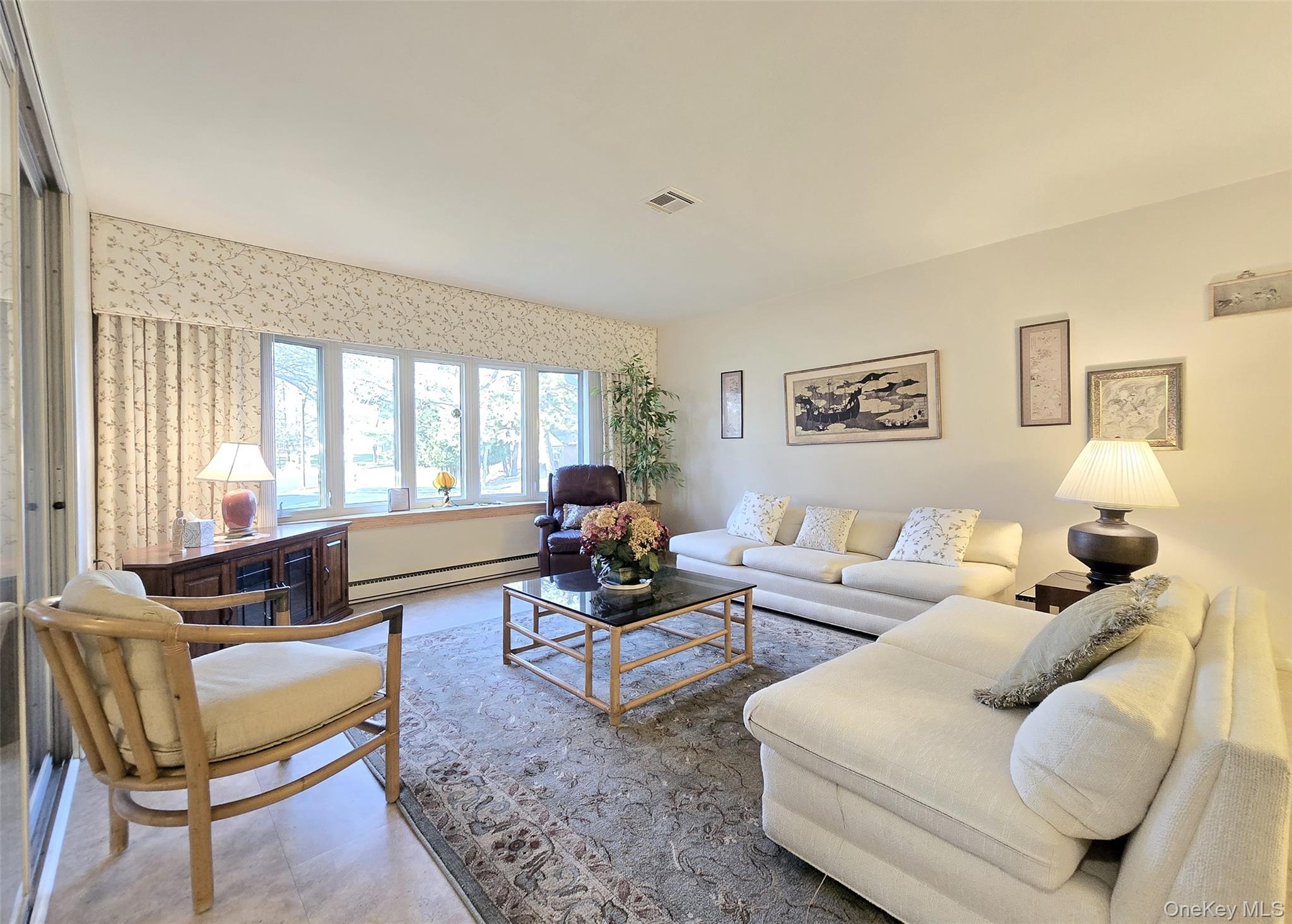 289 Cardiff Court, Unit B Ridge, NY 11961 - Photo 4 of 20 a living room with furniture and a large window