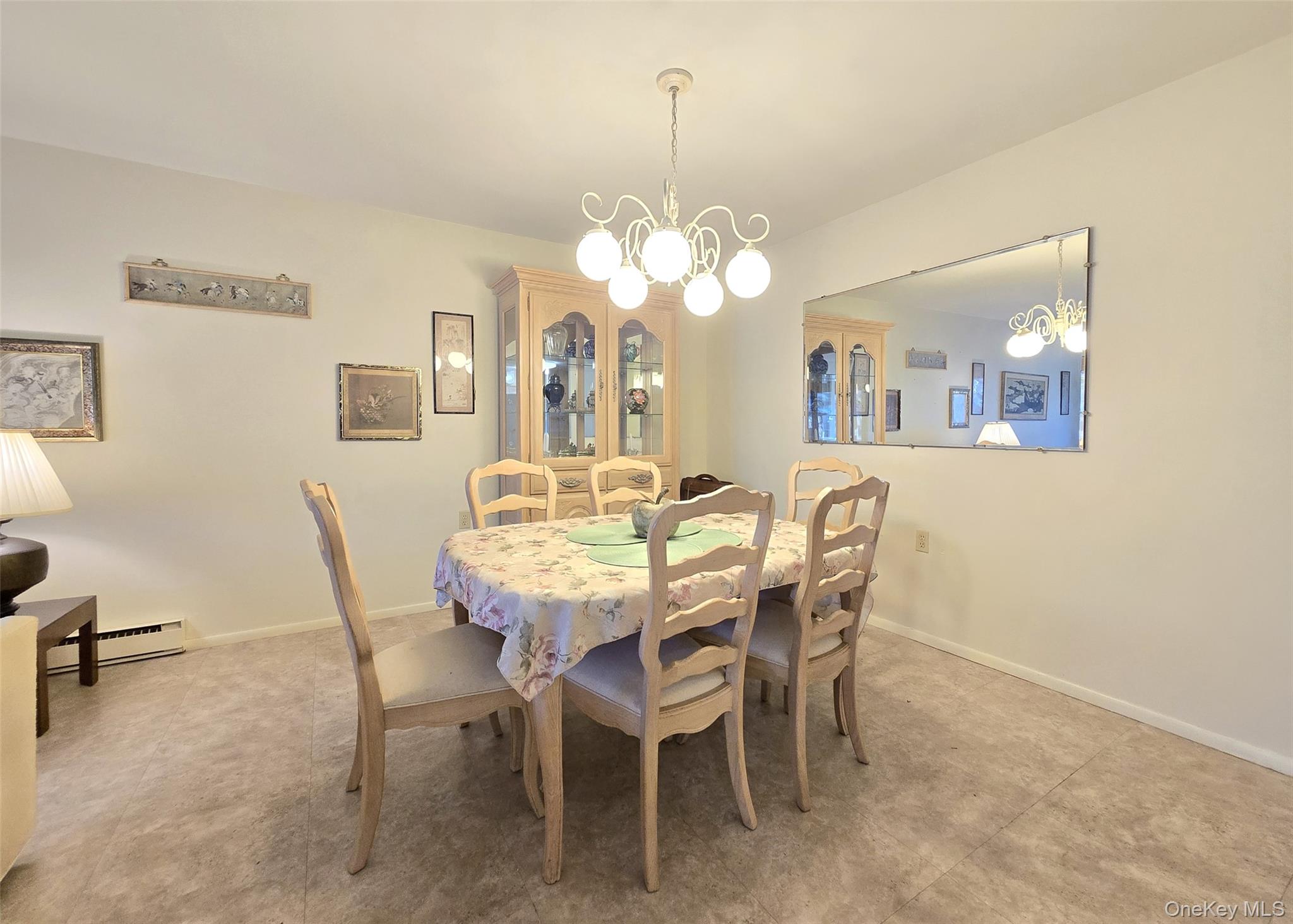 289 Cardiff Court, Unit B Ridge, NY 11961 - Photo 9 of 20 a dining room with furniture and window