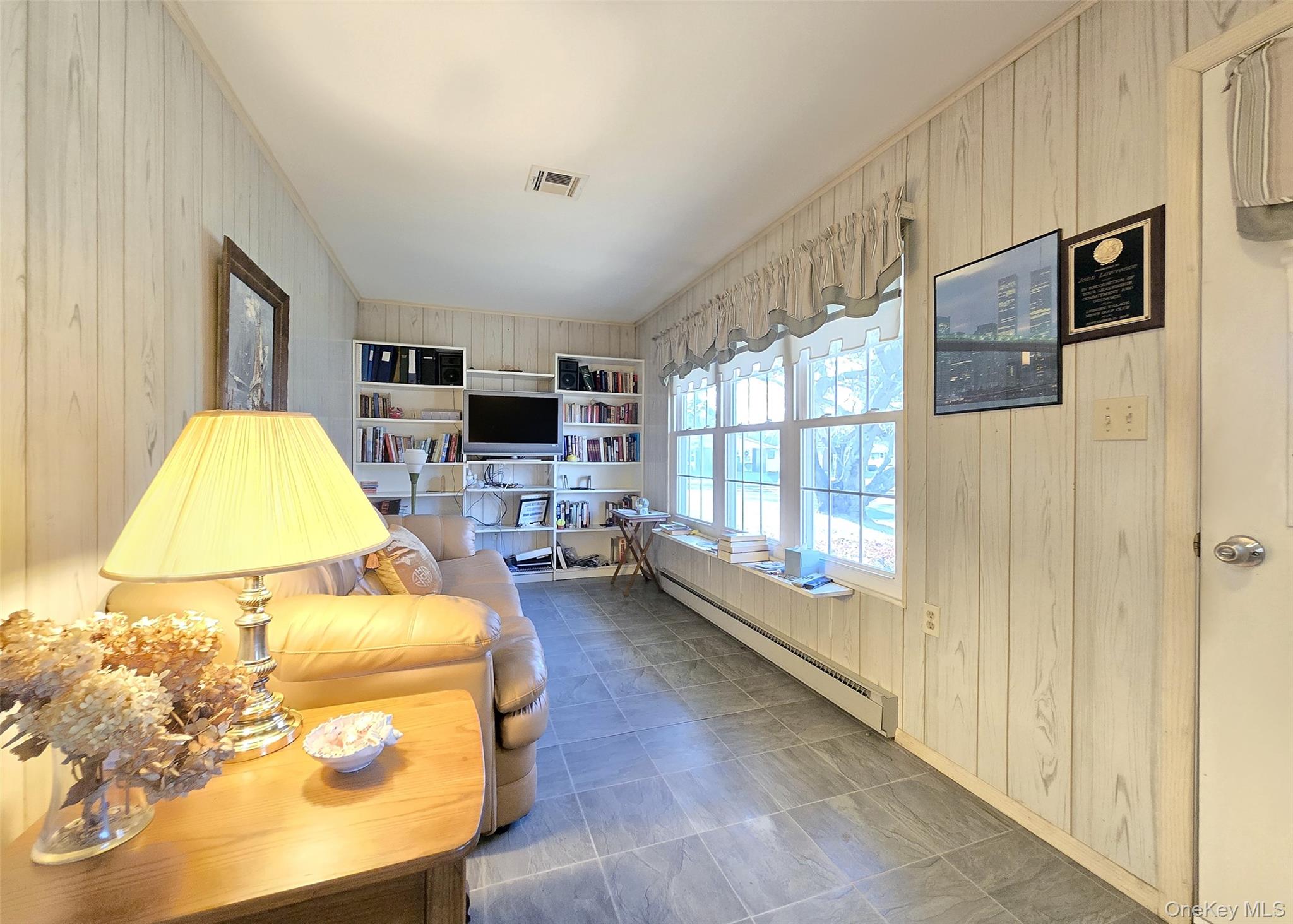 289 Cardiff Court, Unit B Ridge, NY 11961 - Photo 10 of 20 a bed room with a bed and a television