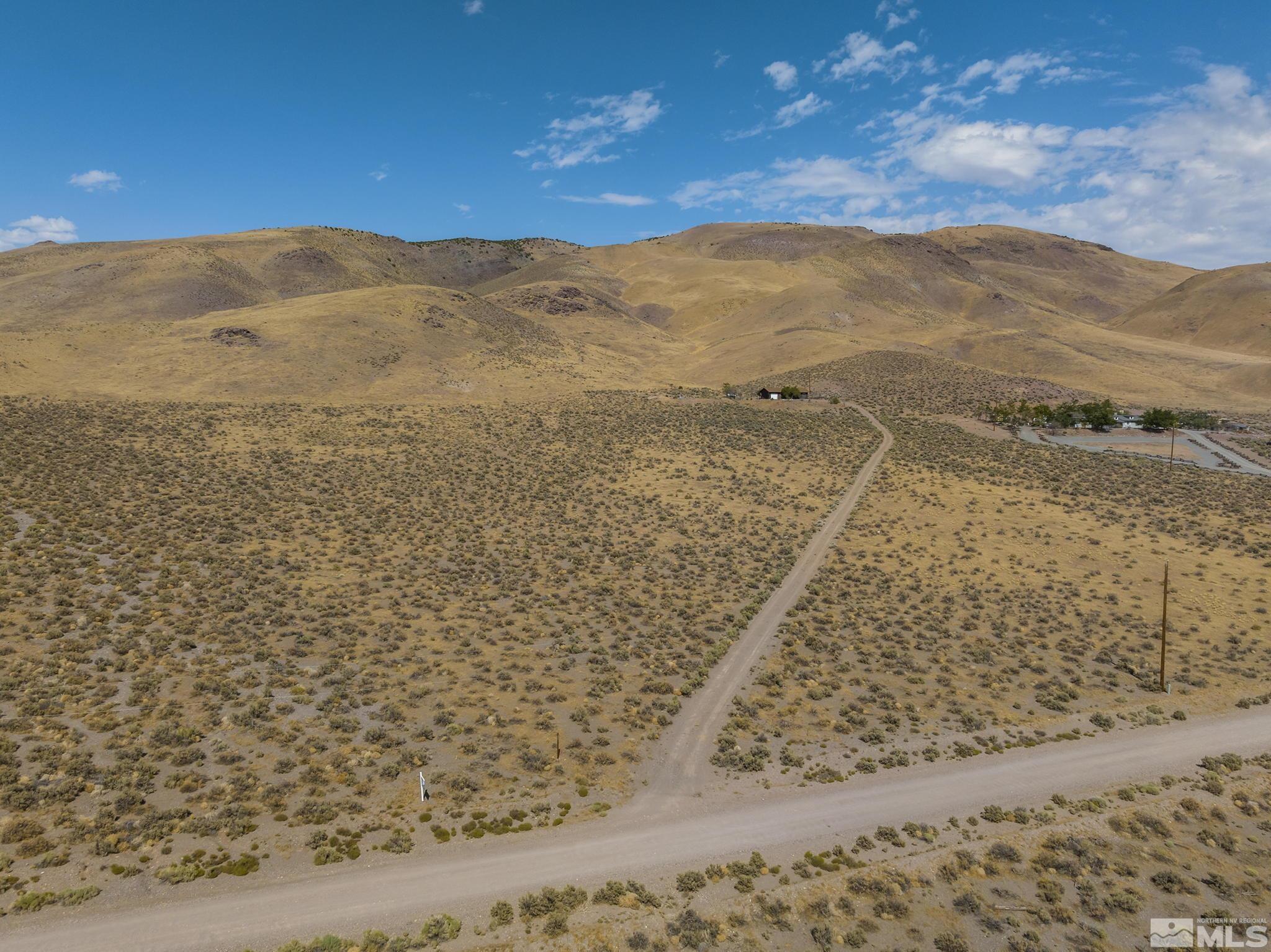 5920 Grass Valley Road Reno, NV 89510 - Photo 2 of 25 a view of a yard with a mountain