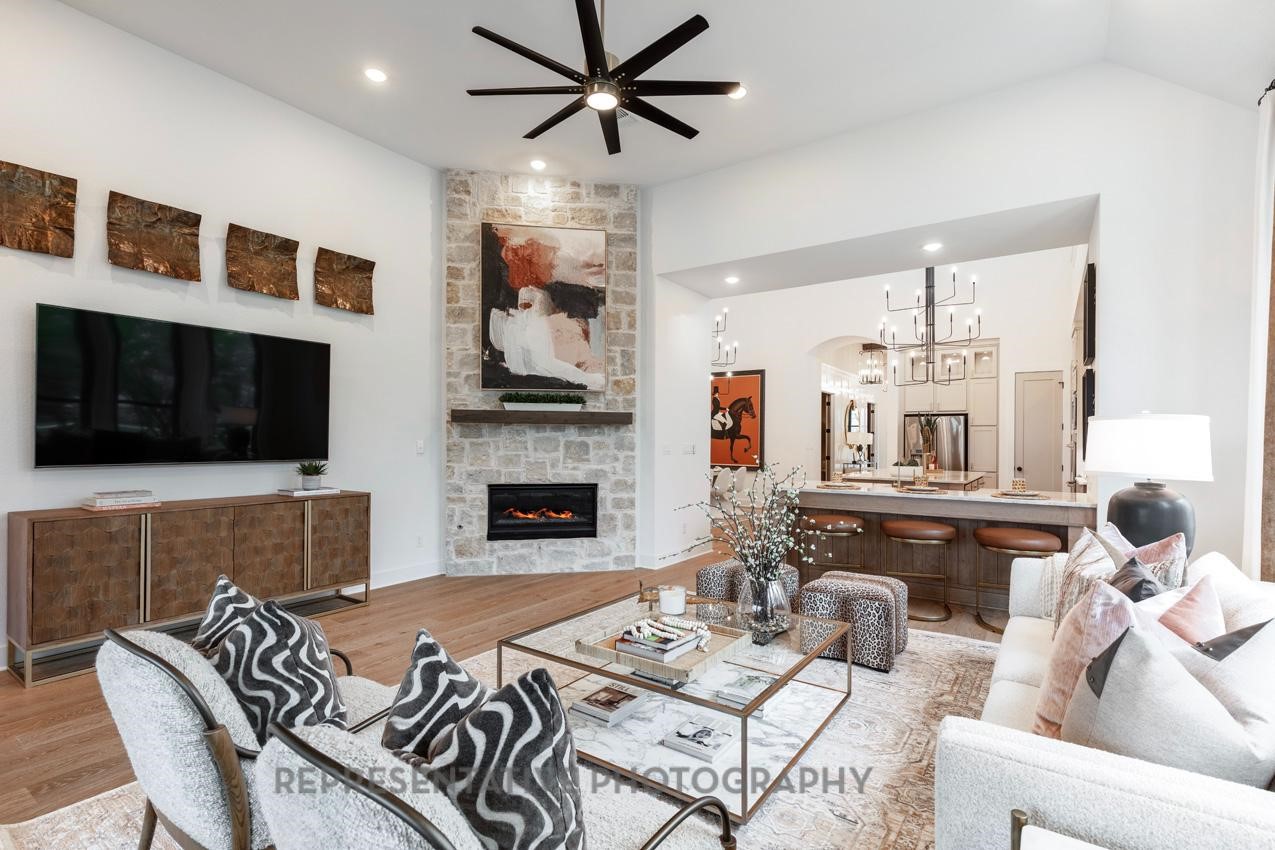 207 Wooded Rill Court Willis, TX 77318 - Photo 6 of 28 a living room with furniture fireplace and flat screen tv