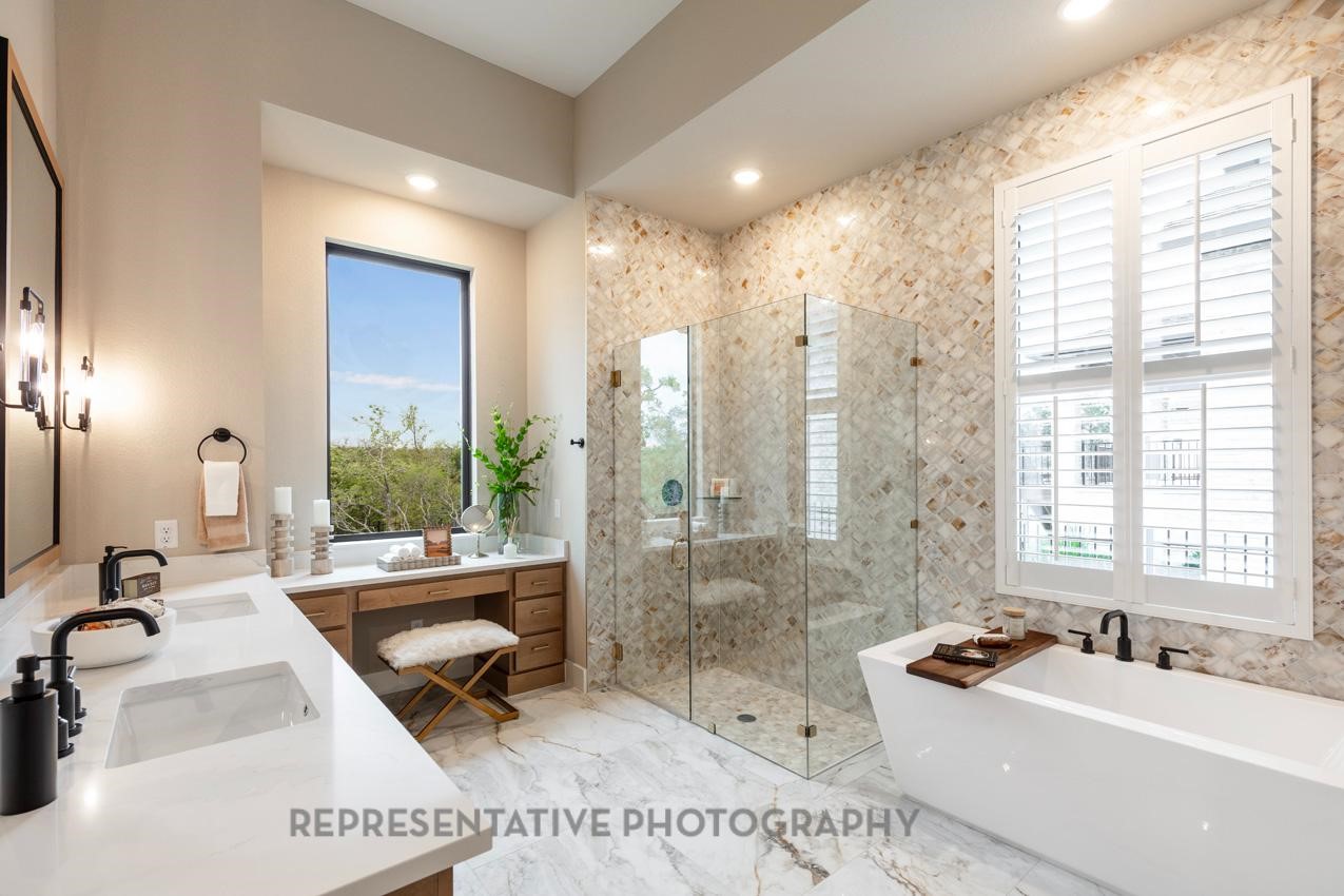 207 Wooded Rill Court Willis, TX 77318 - Photo 9 of 28 a spacious bathroom with sink shower bathtub and next to a window