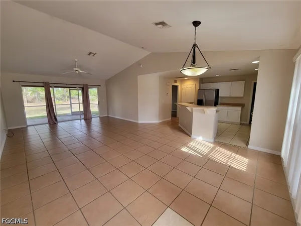 a kitchen with a sink and a refrigerator