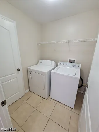a bathroom with a double vanity sink toilet and shower