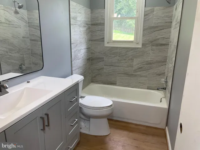 a bathroom with a sink toilet and bathtub