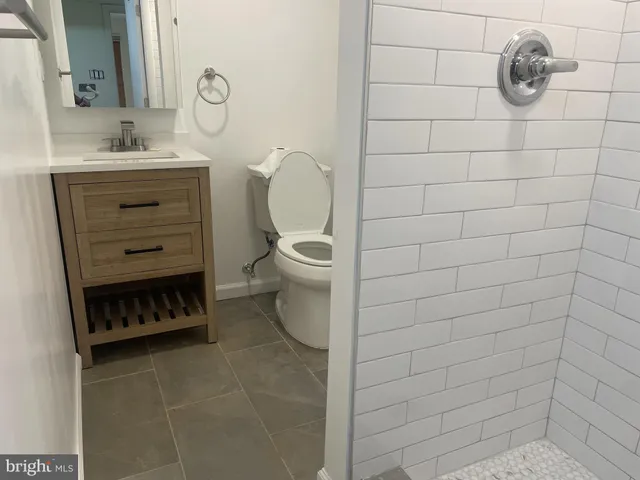 a bathroom with a toilet and a sink