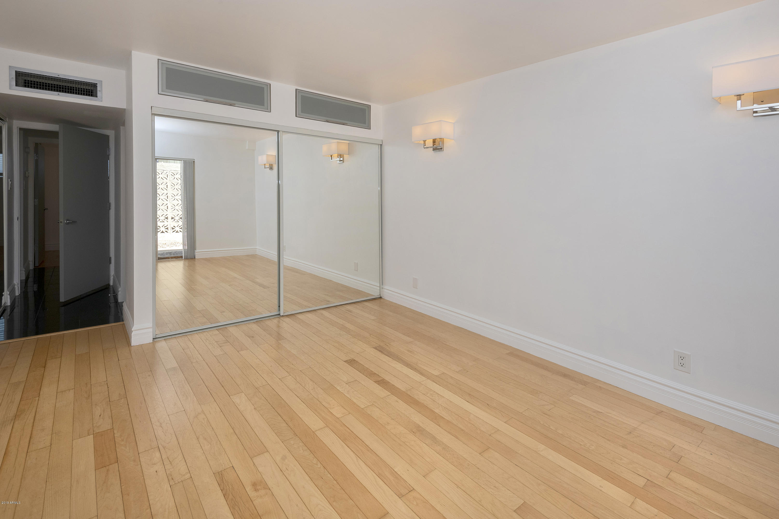 1010 East Osborn Road, Unit A Phoenix, AZ 85014 - Photo 8 of 19 wooden floor in an empty room