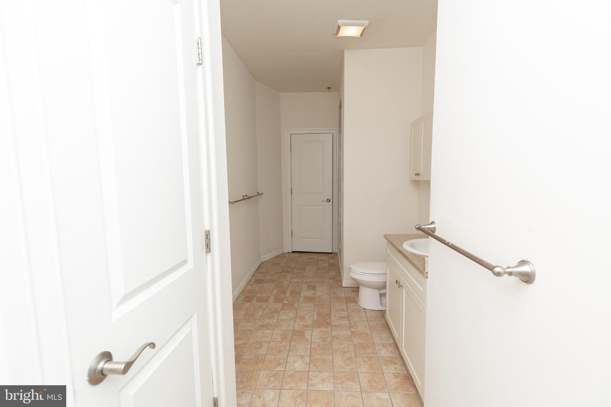 1411-2 Walnut Street, Unit 312 Philadelphia, PA 19102 - Photo 16 of 23 a view of a hallway with white walls