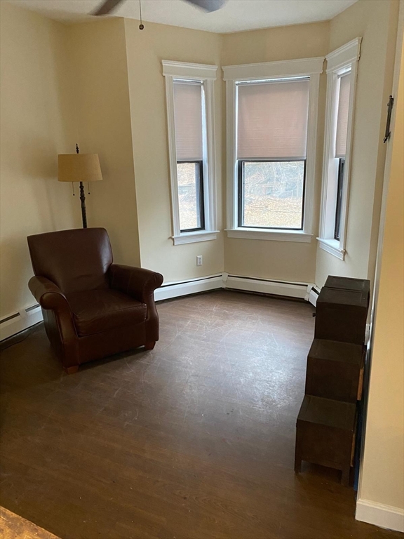 96 Marcella Street, Unit 2 Boston, MA 02119 - Photo 12 of 37 a living room with furniture and a window