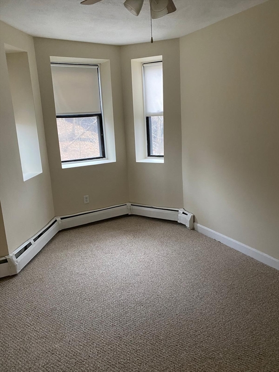 96 Marcella Street, Unit 2 Boston, MA 02119 - Photo 16 of 37 an empty room with a window