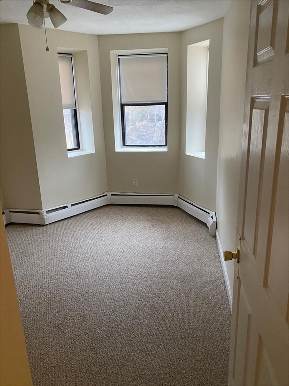 96 Marcella Street, Unit 2 Boston, MA 02119 - Photo 18 of 37 a view of an empty room with a window