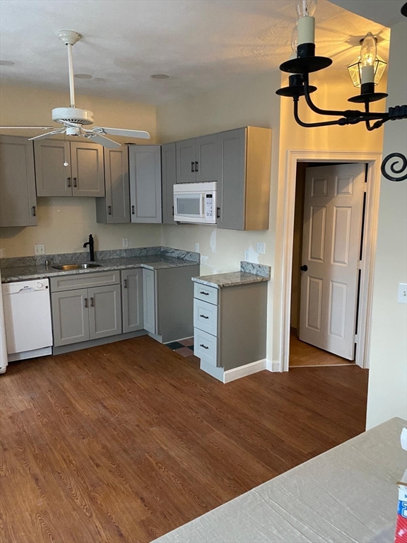 96 Marcella Street, Unit 2 Boston, MA 02119 - Photo 2 of 37 a kitchen with stainless steel appliances granite countertop a sink stove and refrigerator