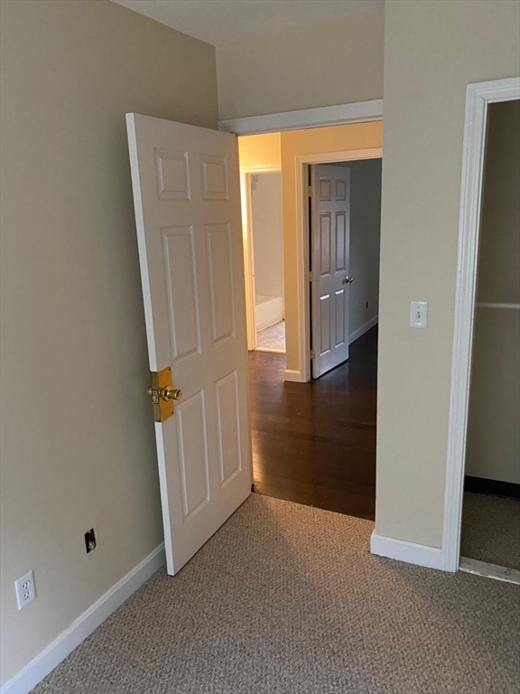 96 Marcella Street, Unit 2 Boston, MA 02119 - Photo 21 of 37 an empty room with windows