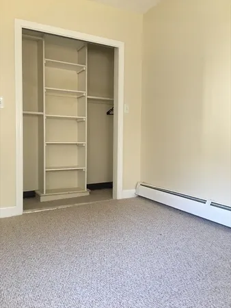 a view of an empty room with a door