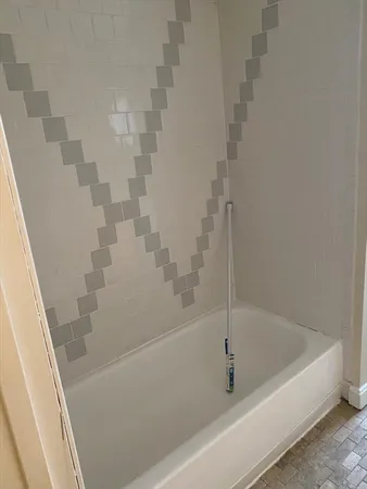 a utility room with a sink a vanity and a mirror