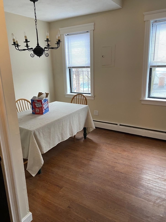 96 Marcella Street, Unit 2 Boston, MA 02119 - Photo 3 of 37 a living room with a bed furniture and a window