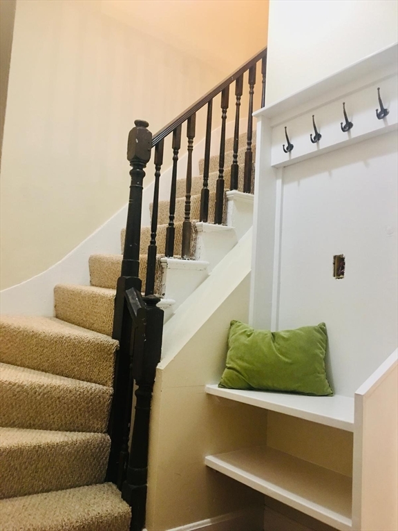 96 Marcella Street, Unit 2 Boston, MA 02119 - Photo 7 of 37 a view of entryway and hall with wooden floor