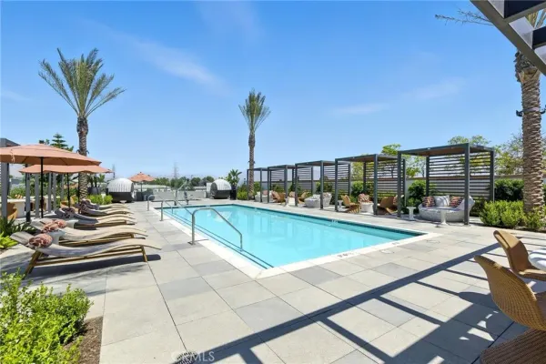 a view of swimming pool with outdoor seating and a terrace