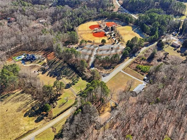 a view of a park with iron fence