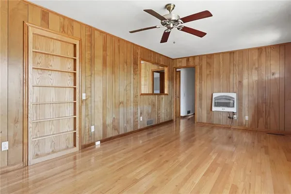 a view of a kitchen with wooden floor and a kitchen