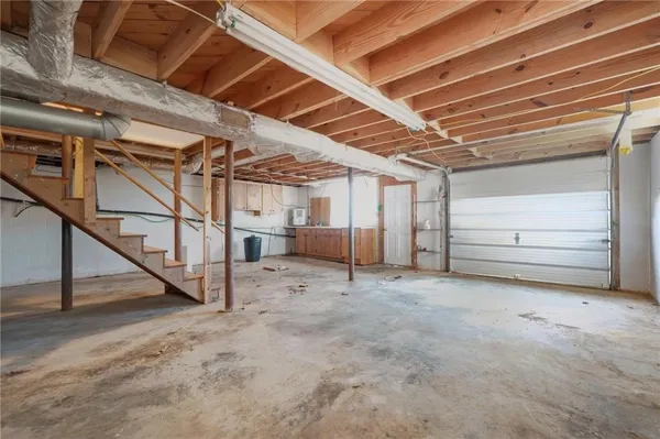 a view of empty room with wooden ceiling