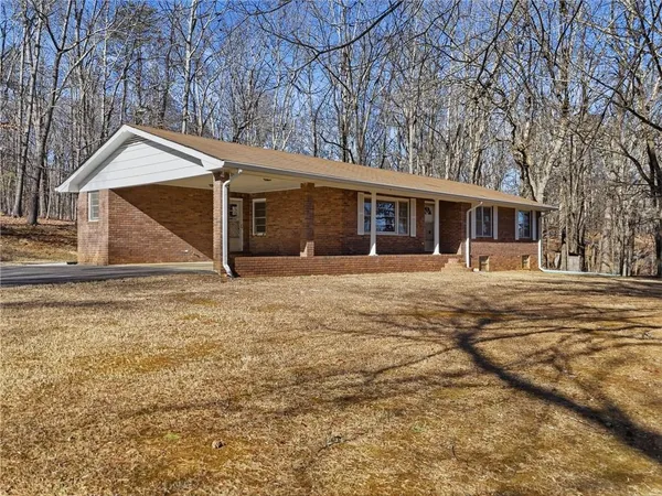 front view of a house with a yard