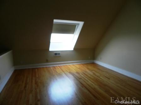 304 Chateau Rive, Unit 304 Peekskill, NY 10566 - Photo 7 of 15 Bonus room with vaulted ceiling and hardwood / wood-style floors