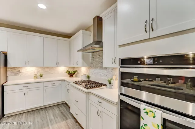 a bathroom with a toilet a sink and a mirror