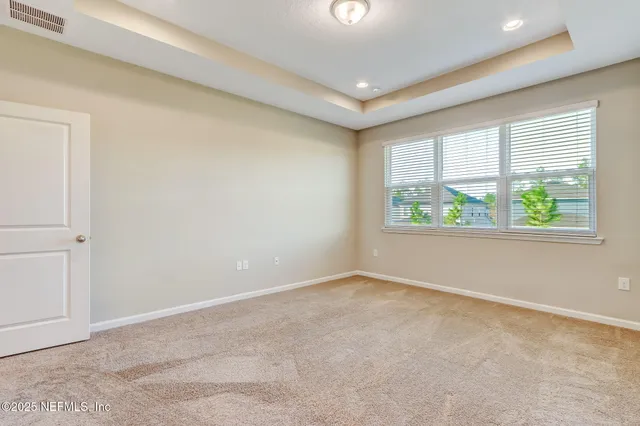 a bathroom with a sink vanity granite and a mirror